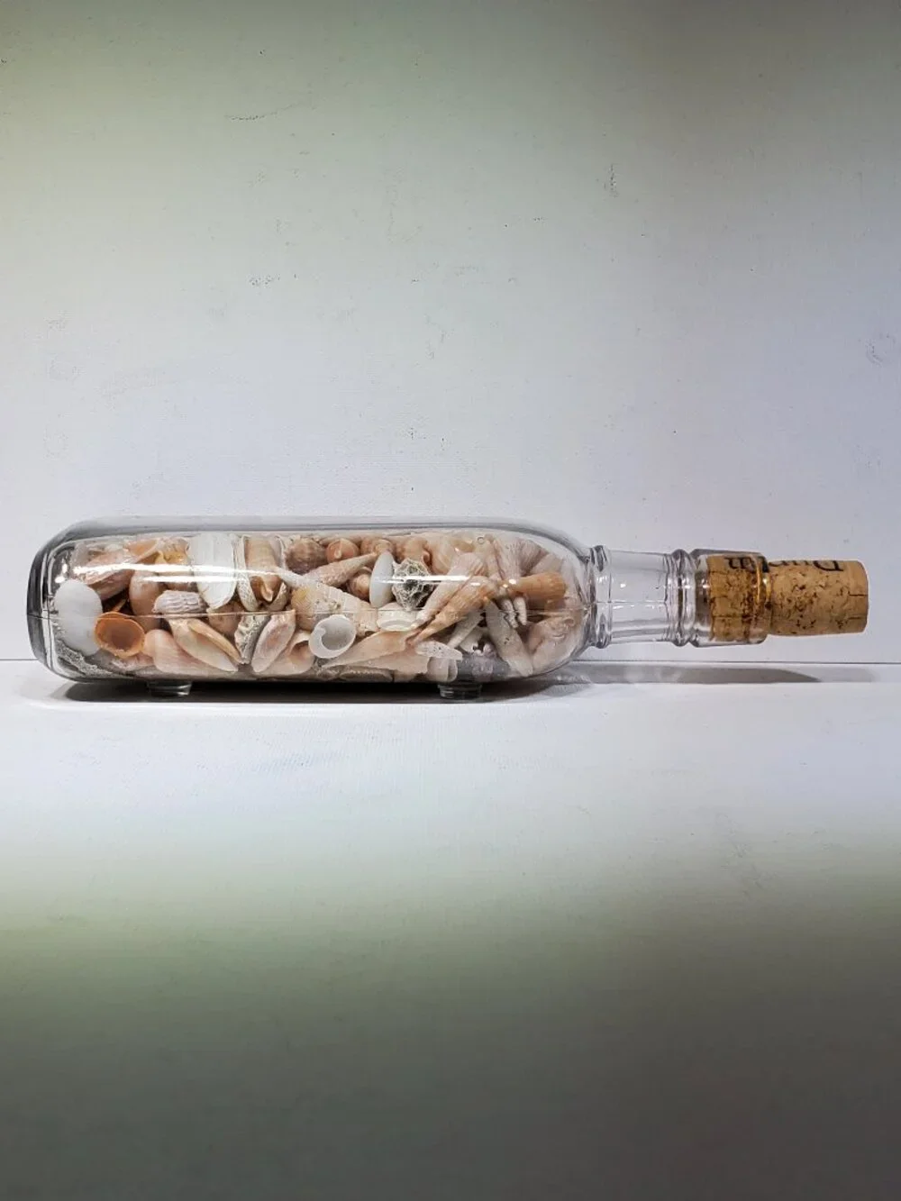 VINTAGE PINT CORK TOP BOTTLE WITH BEACH SHELLS FROM OCEAN DRIVE BEACH SC, 1990